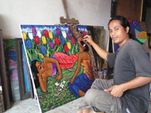 Maleren Manik arbejder p� et Gauguin-inspireret kunstv�rk.